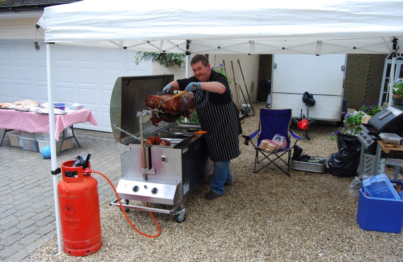 Cllr Gary Williamson hard at work at the Hog Roast